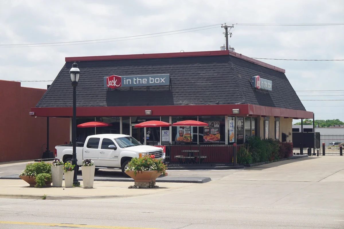 A Jack in the Box restaurant building and drive-thru in Grand Prairie, Texas